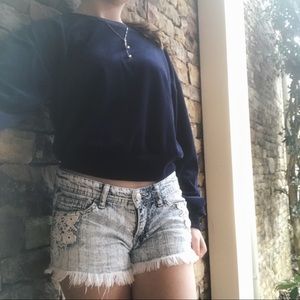 Low rise distressed denim shorts